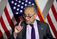 FILE PHOTO: U.S. Senate Majority Leader Chuck Schumer (D-NY) speaks to reporters after the weekly Senate Democratic caucus policy luncheon on Capitol Hill in Washington, U.S., May 11, 2021. REUTERS/Jonathan Ernst/File Photo