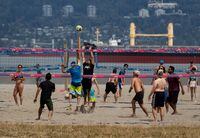 People play beach volleyball at Spanish Banks Beach in Vancouver, B.C., Sunday, July 19, 2020. THE CANADIAN PRESS/Darryl Dyck