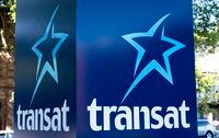 An Air Transat sign is seen in Montreal on May 31, 2016. Quebec real estate developer Group Mach Inc. has made a takeover offer for Transat AT Inc. worth $14 per share in cash. The offer comes after Transat announced last month it was in exclusive talks to be acquired by Air Canada for $13 per share. THE CANADIAN PRESS/Paul Chiasson