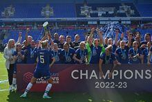 Chelsea's Welsh midfielder Sophie Ingle holds the trophy as Chelsea's players celebrate winning the title after the English Women's Super League football match between Reading and Chelsea  at the Select Car Leasing Stadium in Reading, west of London on May 27, 2023. Chelsea secured a fourth consecutive Women's Super League title after a 3-0 win at Reading held off Manchester United's fight to win the English top flight for the first time. (Photo by JUSTIN TALLIS / AFP) (Photo by JUSTIN TALLIS/AFP via Getty Images)