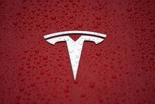 FILE PHOTO: A Tesla logo is seen at a groundbreaking ceremony of Tesla Shanghai Gigafactory in Shanghai, China January 7, 2019. To match Special Report TESLA-PRIVACY/CAMERAS. REUTERS/Aly Song/File Photo