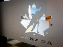 A Hockey Canada logo is seen on the door to the organizations head office in Calgary, Alta., Sunday, Nov. 6, 2022.THE CANADIAN PRESS/Jeff McIntosh