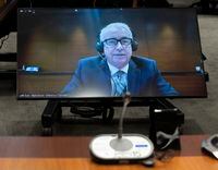 Former Hockey Canada executive Bob Nicholson is seen on a television as he waits to appear as a witness virtually at the Standing Committee on Canadian Heritage, Tuesday, November 15, 2022 in Ottawa.  THE CANADIAN PRESS/Adrian Wyld