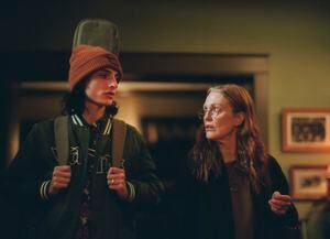 This image released by A24 shows Finn Wolfhard, left, and Julianne Moore in a scene from " When You Finish Saving The World." (Karen Kuehn/A24 via AP)