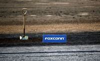 FILE PHOTO: A shovel and FoxConn logo are seen before the arrival of U.S. President Donald Trump as he participates in the Foxconn Technology Group groundbreaking ceremony for its LCD manufacturing campus, in Mount Pleasant, Wisconsin, U.S., June 28, 2018.  REUTERS/Darren Hauck/File Photo