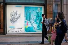 In this Thursday, Nov. 29, 2018 photo, Chinese tourists walk past a Tiffany & Co. flagship in Canton Road, the one-stop-shop high street of high-end brands in Hong Kong. The designer boutiques of Manhattan and Paris are feeling the chill of a Chinese economic slowdown that has hammered automakers and other industries. That is jolting brands such as Louis Vuitton and Burberry that increasingly rely on Chinese customers who spend $90 billion a year on jewelry, clothes and other high-end goods. The industry already is facing pressure to keep up as China’s big spenders shift to buying more at the spreading networks of luxury outlets in their own country. (AP Photo/Kin Cheung)