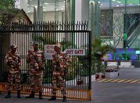 Members of the Indo-Tibetan Border Police (ITBP) stand guard outside a building housing BBC offices, where income tax officials are conducting a search for a second day, in New Delhi, India, February 15, 2023. REUTERS/Altaf Hussain