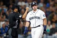 SEATTLE, WASHINGTON - SEPTEMBER 13: Cal Raleigh #29 of the Seattle Mariners reacts after his strikeout during the eighth inning against the San Diego Padres at T-Mobile Park on September 13, 2022 in Seattle, Washington. (Photo by Steph Chambers/Getty Images)