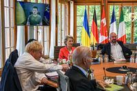 From left, Britain's Prime Minister Boris Johnson, Japan's Prime Minister Fumio Kishida, European Commission President Ursula von der Leyen, US President Joe Biden, European Council President Charles Michel before a round table as Ukraine President Volodymyr Zelenskyy appears on screen to address the G7 leaders via video link during their working session at Castle Elmau in Kruen, near Garmisch-Partenkirchen, Germany, on Monday, June 27, 2022. The Group of Seven leading economic powers are meeting in Germany for their annual gathering Sunday through Tuesday. (Kenny Holston/Pool via AP)