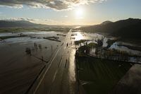 Flood waters cover highway 1 in Abbotsford, B.C., Tuesday, Nov. 16, 2021. THE CANADIAN PRESS/Jonathan Hayward