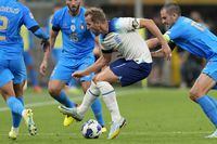 FILE - England's Harry Kane, center, wearing a rainbow armband, controls the ball during the UEFA Nations League soccer match between Italy and England at the San Siro stadium, in Milan, Italy, on Sept. 23, 2022. The anti-discrimination “One Love” captain’s armband controversially denied to teams at the men’s World Cup in Qatar will be worn at the Women’s World Cup next month in an amended version now approved by FIFA. FIFA has unveiled eight campaign armbands on Friday, June 30, 2023. (AP Photo/Antonio Calanni, File)