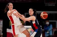 Canada's Bridget Carleton (6), left, passes around South Korea's Hyeyoon Bae (11) during women's basketball preliminary round game at the 2020 Summer Olympics, Thursday, July 29, 2021, in Saitama, Japan. Bridget Carleton made the Transatlantic trip home from Israel for this week's Canadian women's basketball camp. THE CANADIAN PRESS/AP, Charlie Neibergall
