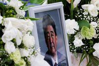 FILE PHOTO: A picture of late former Japanese Prime Minister Shinzo Abe, who was shot while campaigning for a parliamentary election, is seen at Headquarters of the Japanese Liberal Democratic Party in Tokyo, Japan July 12, 2022. REUTERS/Kim Kyung-Hoon/File Photo