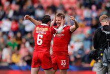 Alex Russell and Kalin Sager celebrate Canada’s cup quarter-final win over Australia on Day 2 of the HSBC France Sevens on Saturday, May 13, 2023, at Stade Toulousa in Toulouse, France. THE CANADIAN PRESS/HO-World Rugby-Mike Lee **MANDATORY CREDIT**  