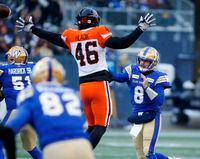 Winnipeg Blue Bombers quarterback Zach Collaros (8) throws with pressure from BC Lions' Ben Hladik (46) during the first half of CFL western final action in Winnipeg, Sunday, Nov. 13, 2022. THE CANADIAN PRESS/John Woods      