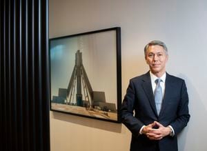 Mike Henry, CEO of Australian mining company BHP, standing beside a photograph of the company’s Jansen potash project, located in Saskatchewan, Canada, is photographed on Oct 17, 2023. (Fred Lum/The Globe and Mail)