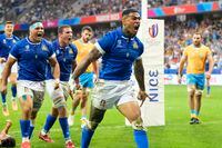 Italy's Montanna Ioane, right, reacts after scoring a try during the Rugby World Cup Pool A match between Italy and Uruguay at the Stade de Nice, in Nice, Wednesday, Sept. 20, 2023. (AP Photo/Pavel Golovkin)