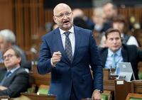 Minister of Justice and Attorney General of Canada David Lametti rises during Question Period, Wednesday, September 28, 2022 in Ottawa.  THE CANADIAN PRESS/Adrian Wyld