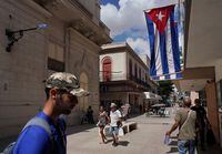 Cuban flags are displayed at a commercial road in downtown Havana, Cuba, July 20, 2022. REUTERS/Alexandre Meneghini