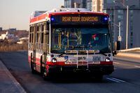 A TTC bus drives along Don Mills Road, in Toronto, on April 6, 2020.
