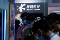 Visitors are seen at the Tencent Games booth during the China Digital Entertainment Expo and Conference, also known as ChinaJoy, in Shanghai, China July 30, 2021. Picture taken July 30, 2021. REUTERS/Aly Song