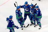 Vancouver Canucks' J.T. Miller (9), Brock Boeser (6), Elias Pettersson (40), Quinn Hughes (43) and Bo Horvat (53) celebrate a goal against the Minnesota Wild during third period NHL Stanley Cup qualifying round action in Edmonton, Tuesday, Aug. 4, 2020.