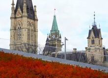The Peace Tower and the West Block are pictured over a garden at the Bank of Canada in Ottawa, on Wednesday, Oct. 26, 2022. THE CANADIAN PRESS/Sean Kilpatrick