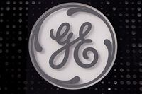 The General Electric logo is displayed on a sign outside their headquarters in Boston, Nov. 10, 2021. GE Appliances says it is offering sponsorship money&nbsp; in hopes of helping resolve the labour impasse between Canada Soccer and the women's national team. THE CANADIAN PRESS/AP-Charles Krupa