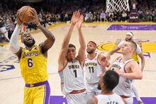 Los Angeles Lakers forward LeBron James shoots against the Denver Nuggets in the first half of Game 4 of the NBA basketball Western Conference Final series Monday, May 22, 2023, in Los Angeles. (AP Photo/Mark J. Terrill)