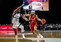 Team Canada's Kassius Robertson (0) tries to get past Team Venezuela's Nestor Colmenares (43) during second half FIBA World Cup Qualifiers basketball action in Edmonton on Thursday, November 10, 2022.THE CANADIAN PRESS/Jason Franson