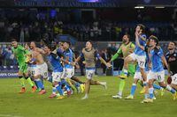 Napoli's team players celebrate as they won the group A Champions League soccer match between Napoli and Liverpool at the Diego Armando Maradona stadium in Naples, Italy, Wednesday, Sept. 7, 2022. (AP Photo/Andrew Medichini)