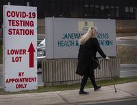 A visitor walks toward the Janeway Children's Hospital in St. John's, N.L., on Thursday, May 6, 2021. COVID-19 hospitalizations have dropped in Newfoundland and Labrador, while the number of confirmed active cases has seen a slight increase. THE CANADIAN PRESS/Paul Daly