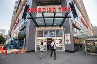 Shoppers and pedestrians are photographed outside the Canadian Tire store at Dundas St. West and Bay St. in Toronto on Aug. 6 2020.