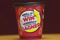 A Tim Hortons cup is shown in Toronto on Thursday, February 3, 2017. Tim Hortons say a technical error caused some customers using the restaurant's app to receive an incorrect award message during the first day of its Roll Up To Win contest. THE CANADIAN PRESS/Nathan Denette