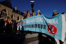 Demonstrators rally against alleged organ harvesting in China outside West Block on Parliament Hill in Ottawa, Ontario, Canada December 14, 2022. REUTERS/Blair Gable