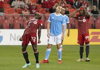 Aug 7, 2021; Toronto, Ontario, CAN; Toronto FC midfielder Richie Laryea (22) and forward Ifunanyachi Achara (99) react after missing a chance at goal against New York City FC during the second half at BMO Field. Mandatory Credit: Nick Turchiaro-USA TODAY Sports