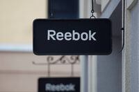 FILE PHOTO: Boards with Reebok store logo are seen on a shopping center at the outlet village Belaya Dacha outside Moscow, Russia, April 23, 2016.  REUTERS/Grigory Dukor/File Photo