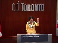 Newly elected Mayor Olivia Chow waves to the crowd at council chambers during her Declaration of Office Ceremony, at Toronto City Hall  on Wednesday, July 12, 2023. THE CANADIAN PRESS/Tijana Martin