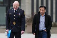 Vancouver Police Chief Adam Palmer, left, and Mayor Ken Sim, arrive for a news conference, in Vancouver, on Sunday, February 5, 2023. Vancouver city council is set to review recommendations for a $2.8 million grant to Vancouver Coastal Health. THE CANADIAN PRESS/Darryl Dyck