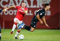 Pacific FC's Alessandro Hojabrpour, right, collides with Cavalry FC's Nik Ledgerwood during second half soccer action in the Canadian Championship quarterfinal in Calgary, Alta., Wednesday, Sept. 22, 2021.THE CANADIAN PRESS/Jeff McIntosh