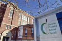 &nbsp;A Toronto District School Board logo is seen on a sign in front of a high school in Toronto, Tuesday, Jan. 30, 2018.&nbsp;An anti-racism trainer accused of denigrating a Toronto principal who later died by suicide says she welcomes the Ontario education minister's review.&nbsp;THE CANADIAN PRESS/Frank Gunn