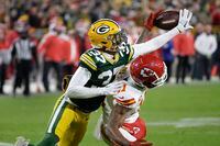Green Bay Packers cornerback Carrington Valentine (37) breaks up a pass intended for Kansas City Chiefs wide receiver Marquez Valdes-Scantling (11) during the second half of an NFL football game Sunday, Dec. 3, 2023 in Green Bay, Wis. (AP Photo/Mike Roemer)