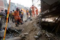 Rescue workers conduct an operation to clear the rubble and search for bodies at the site of Monday's suicide bombing, in Peshawar, Pakistan, Tuesday, Jan. 31, 2023. The death toll from the previous day's suicide bombing at a mosque in northwestern Pakistani rose to more than 85 on Tuesday, officials said. The assault on a Sunni Mosque inside a major police facility was one of the deadliest attacks on Pakistani security forces in recent years. (AP Photo/Muhammad Zubair)