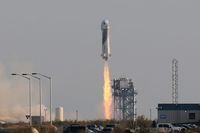 Billionaire businessman Jeff Bezos is launched with three crew members aboard a New Shepard rocket on the world's first unpiloted suborbital flight from Blue Origin's Launch Site 1 near Van Horn, Texas , U.S., July 20, 2021. REUTERS/Joe Skipper