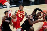 Apr 22, 2022; Atlanta, Georgia, USA; Atlanta Hawks forward John Collins (20) fights for a rebound with Miami Heat guard Kyle Lowry (7) and center Bam Adebayo (13) during the second half during game three of the first round of the 2022 NBA playoffs at State Farm Arena. Mandatory Credit: Dale Zanine-USA TODAY Sports