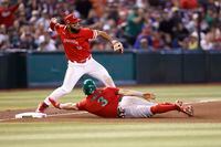 PHOENIX, ARIZONA - MARCH 15: Luis Urías #3 of Team Mexico safely slides into third over Abraham Toro #13 of Team Canada during the sixth inning of the World Baseball Classic Pool C game at Chase Field on March 15, 2023 in Phoenix, Arizona. (Photo by Chris Coduto/Getty Images)