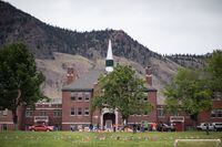 The former Kamloops Indian Residential School in June 2021 in Tk’emlúps te Secwe?pemc in the B.C. Interior,In late May Tk’emlúps te Secwépemc announced the discovery of 215 remains in unmarked graves at one of Canada’s largest former residential schools. 