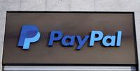 The PayPal logo is seen at an office building in Berlin, Germany, March 5, 2019.   REUTERS/Fabrizio Bensch/Files