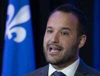 Mathieu Lacombe responds to reporters' questions at the beginning of a pre-session caucus meeting, Wednesday, Sept. 8, 2021, in Quebec City. The minister of families told reporters that if the Coalition Avenir Québec is re-elected, the party would convert all unsubsidized daycare spots into subsidized spaces at a cost of $1.4 billion over five years. THE CANADIAN PRESS/Jacques Boissinot