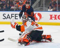 Oct 27, 2021; Edmonton, Alberta, CAN; Philadelphia Flyers goaltender Carter Hart (79) makes a glove save in front of Edmonton Oilers forward Ryan Nugent-Hopkins (93) during the first period at Rogers Place. Mandatory Credit: Perry Nelson-USA TODAY Sports
